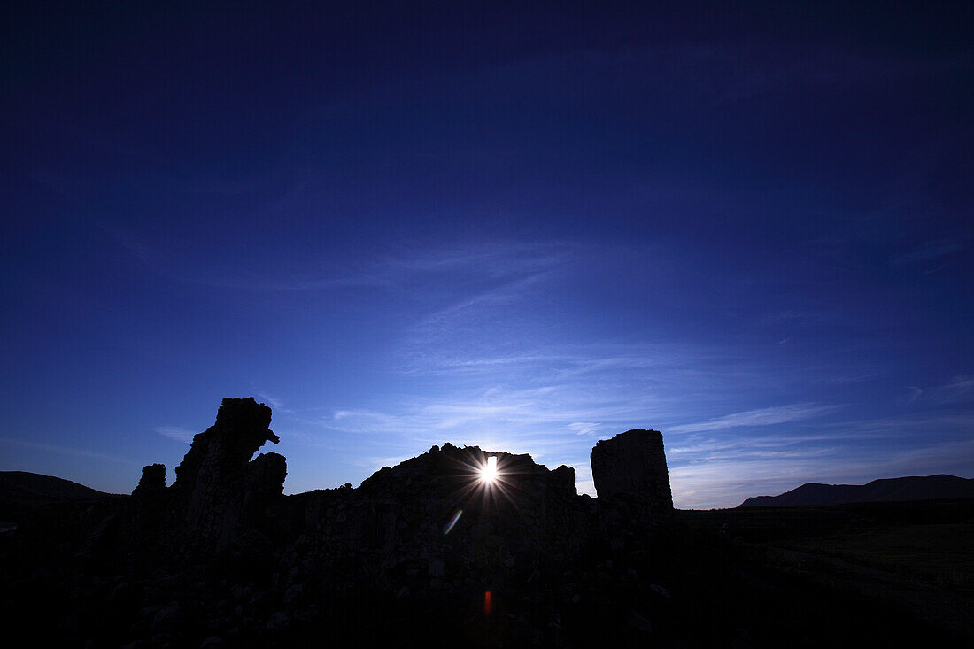 Sunbeam shining through ruins, near Baza, Andalusia, Spain