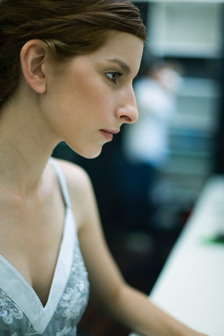 Young woman looking away, profile