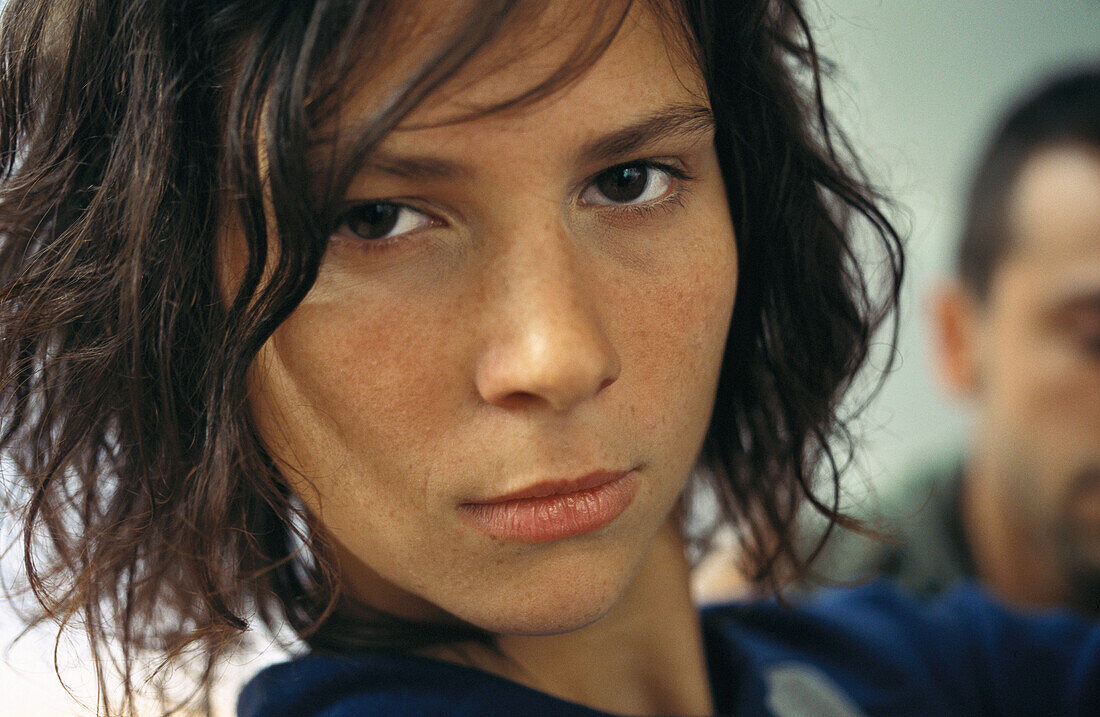 Young woman looking at camera, headshot