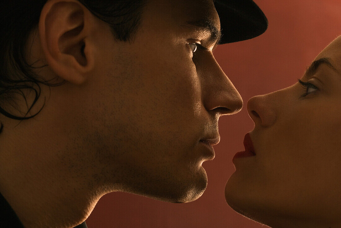 Couple face to face, looking at each other, profile, close-up