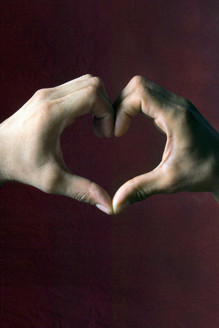 Hands together forming heart