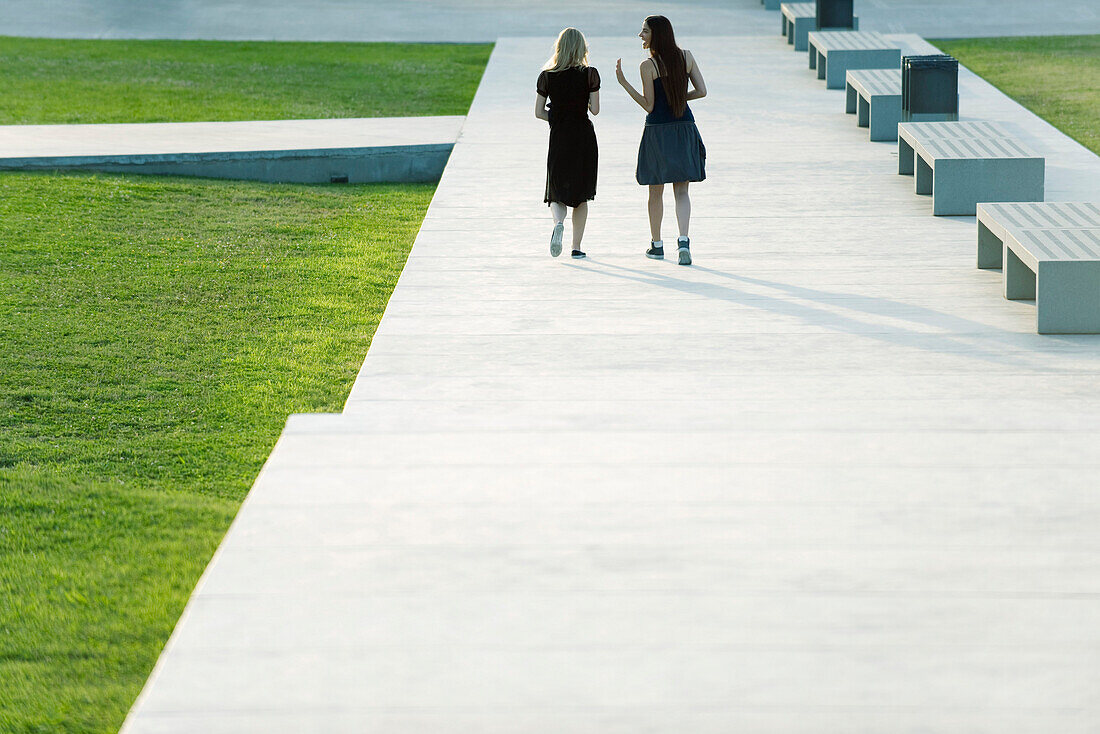 Friends walking together in conversation