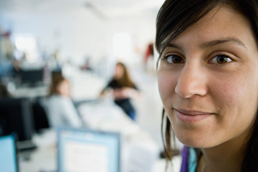 Young woman working in office, portrait