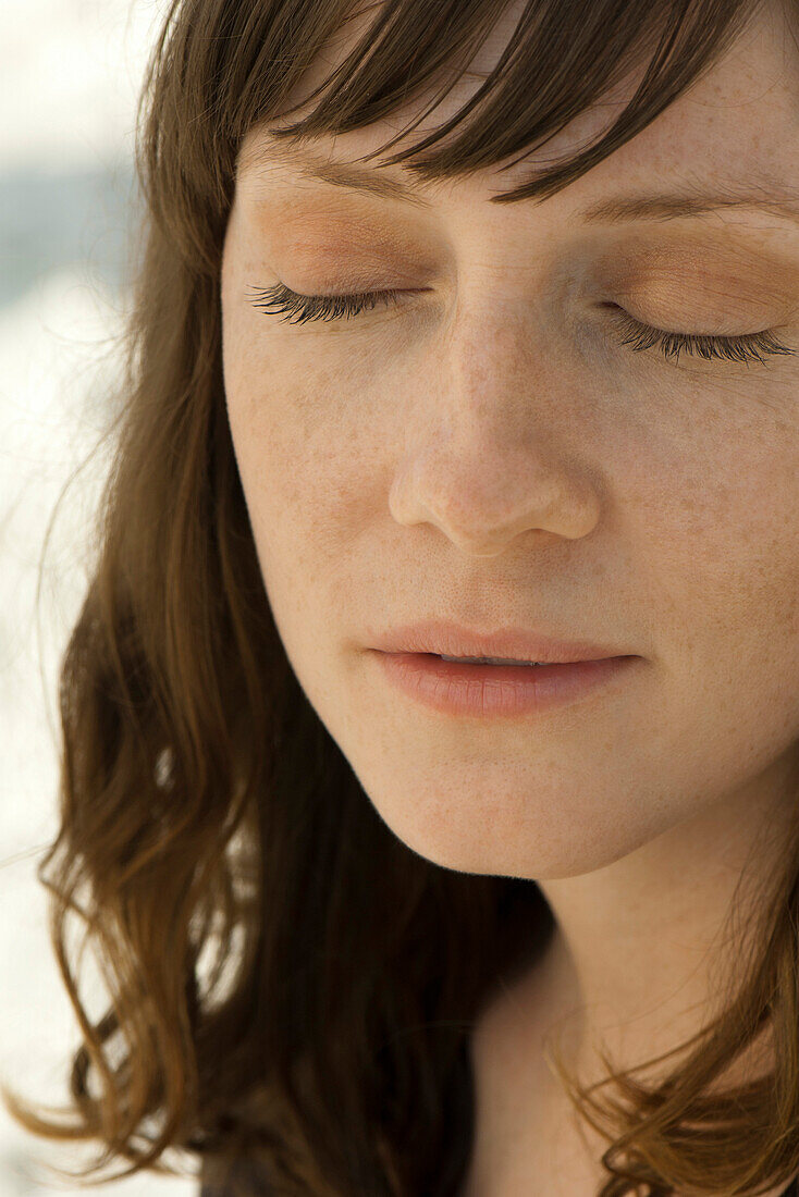 Woman with eyes closed, portrait