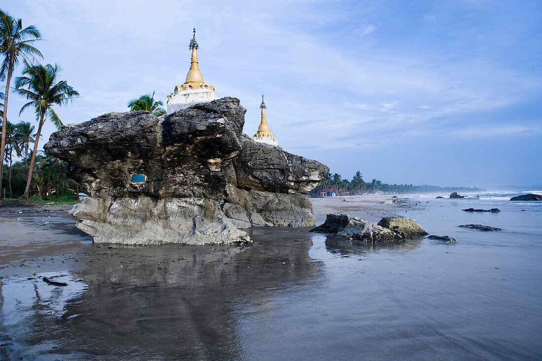 Two pagodas on top of rocks at Ngwe Saung Beach, Myanmar