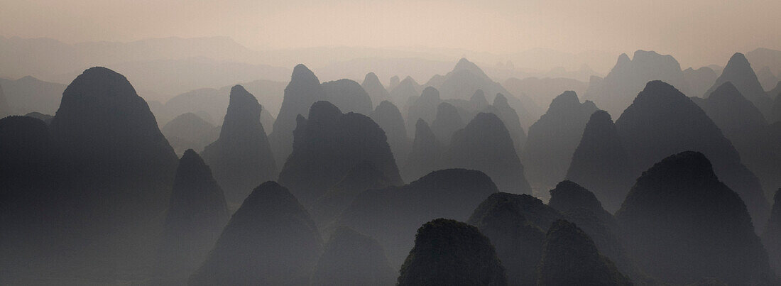 Silhouetted karst peaks, Yangshuo county, Guilin, Guangxi, China