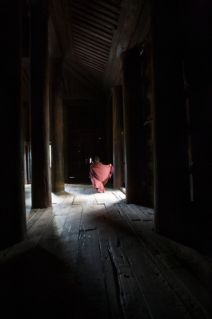 Bagaya Kyaung monastery, Inwa, Myanmar, monk running in the distance