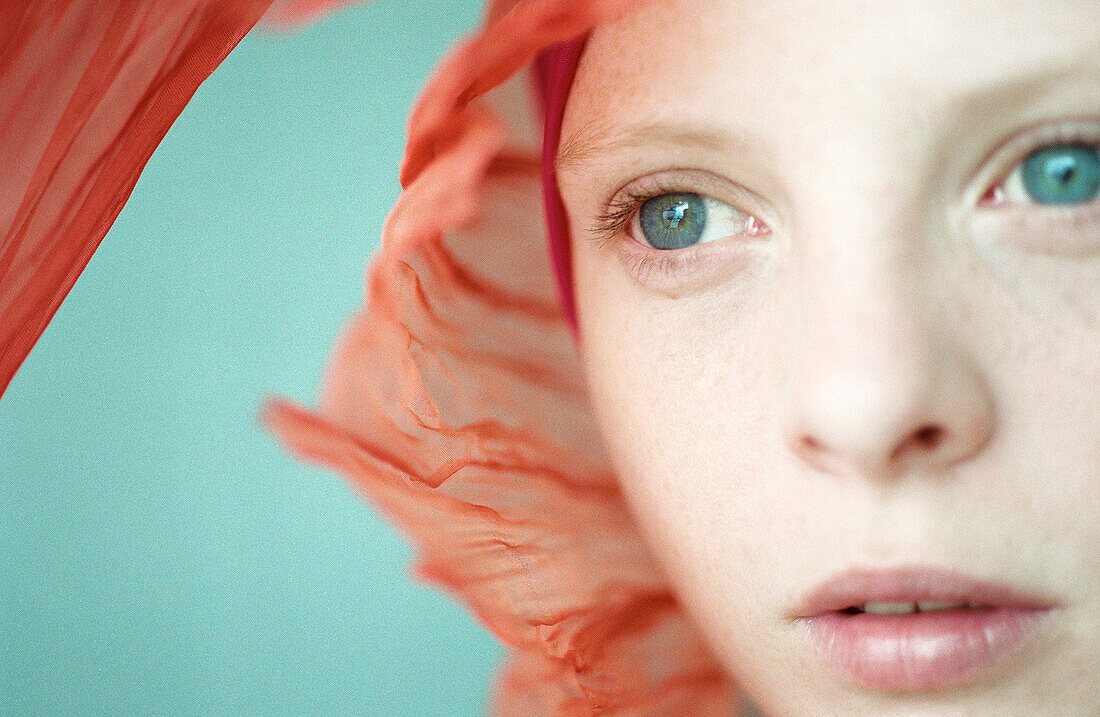 Young woman wearing headscarf, close-up