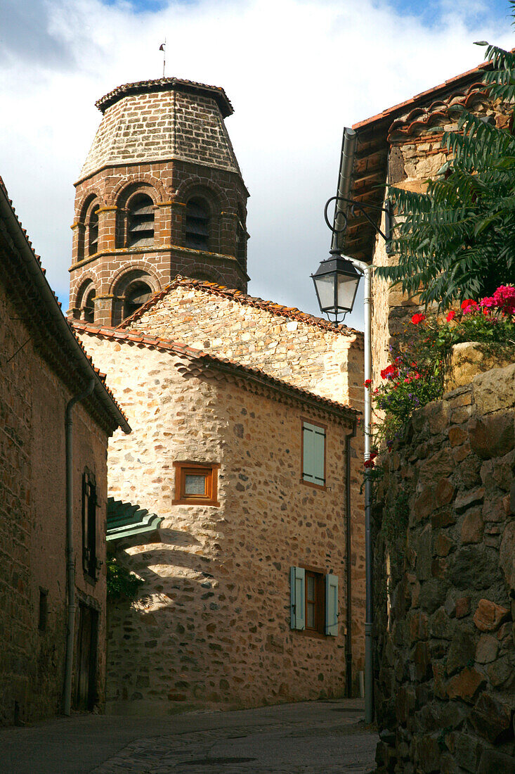 France, Auvergne, Haute-Loire, Lavaudieu, street and bell tower of abbbey church