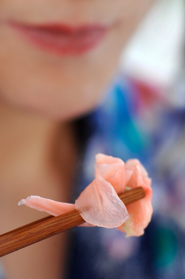 Close-up of chopsticks and ginger