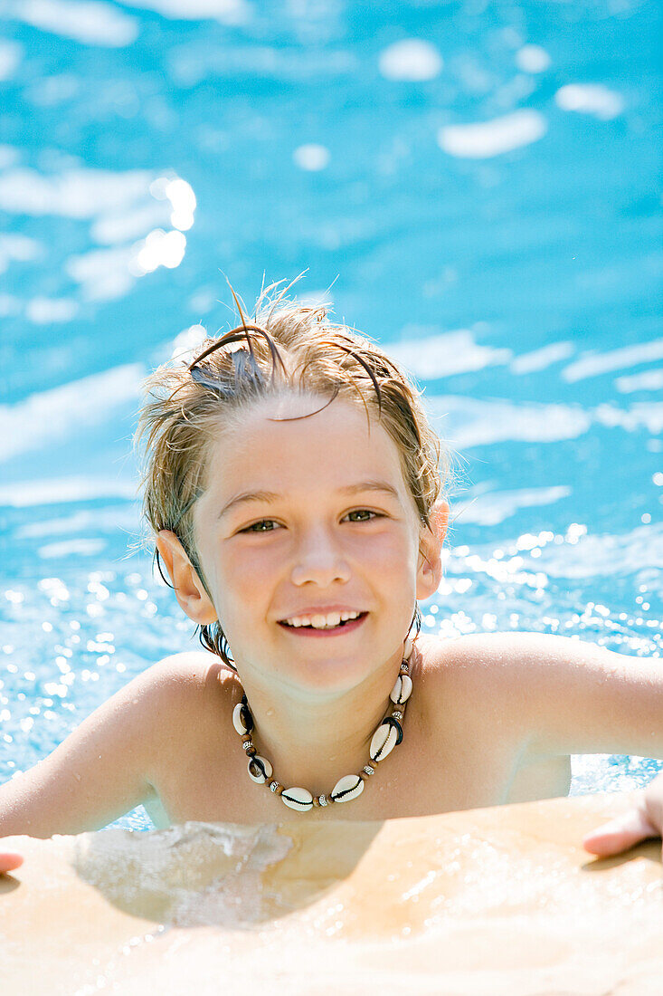 Smiling boy in pool