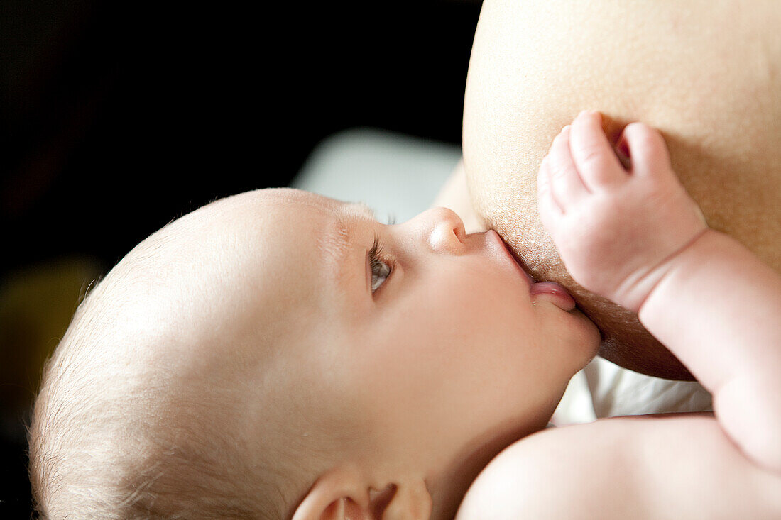 Mother breastfeeding baby