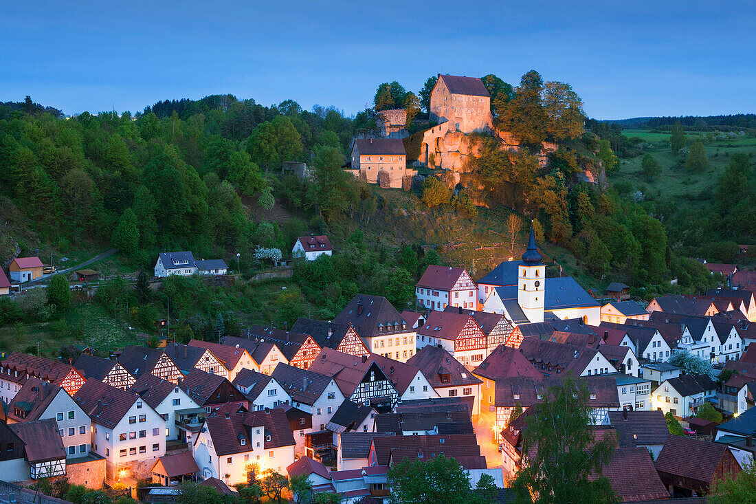 View ofer the town onto the castle in the evening light, Pottenstein, Fraenkische Schweiz, Franconia, Bavaria, Germany, Europe