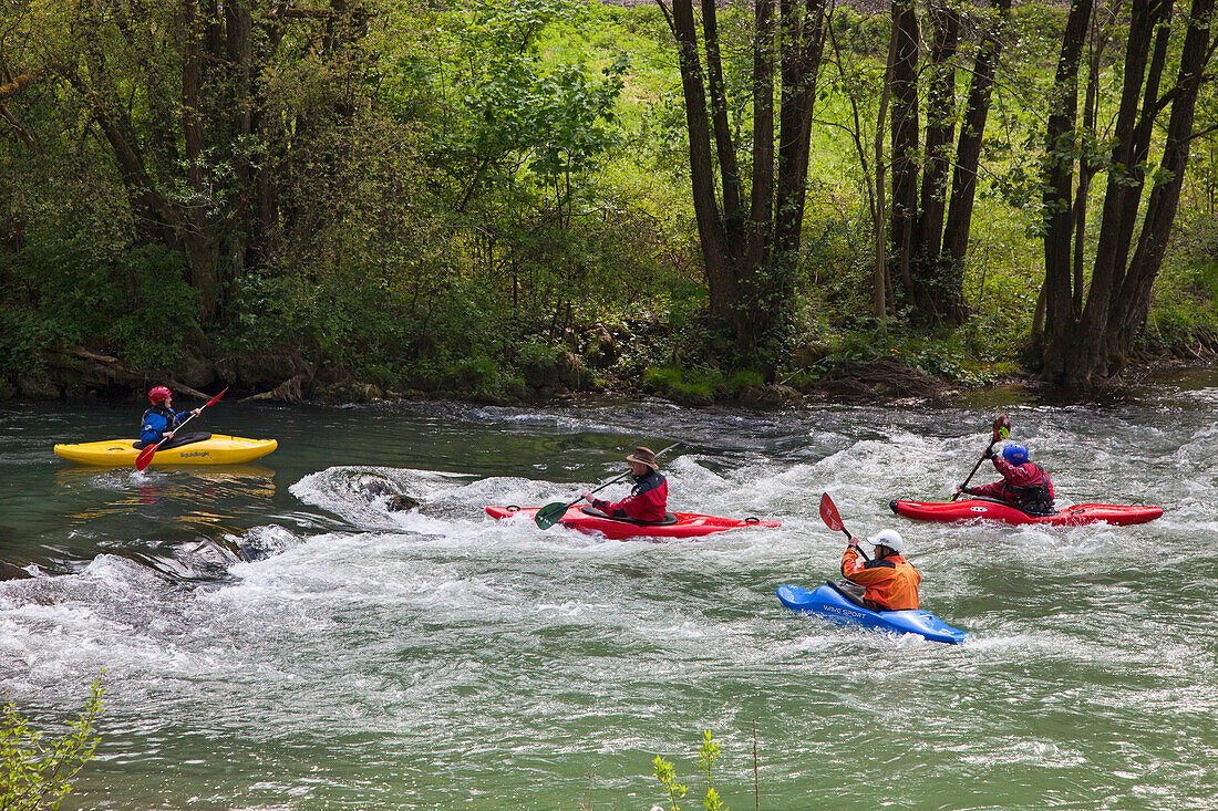 People canoeing at Wiesent valley, Fraenkische Schweiz, Franconia, Bavaria, Germany, Europe