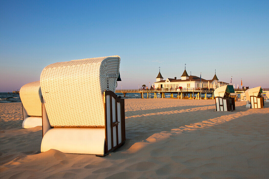 Beach chairs and pier in the light of the evening sun, Ahlbeck seaside resort, Usedom island, Baltic Sea, Mecklenburg-West Pomerania, Germany, Europe