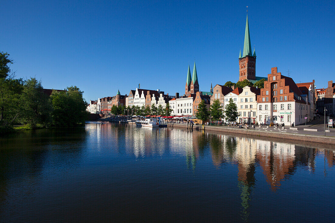 View over the Trave river to the old town of Luebeck with St Mary´s church and church of St Petri, Hanseatic city of Luebeck, Baltic Sea, Schleswig-Holstein, Germany