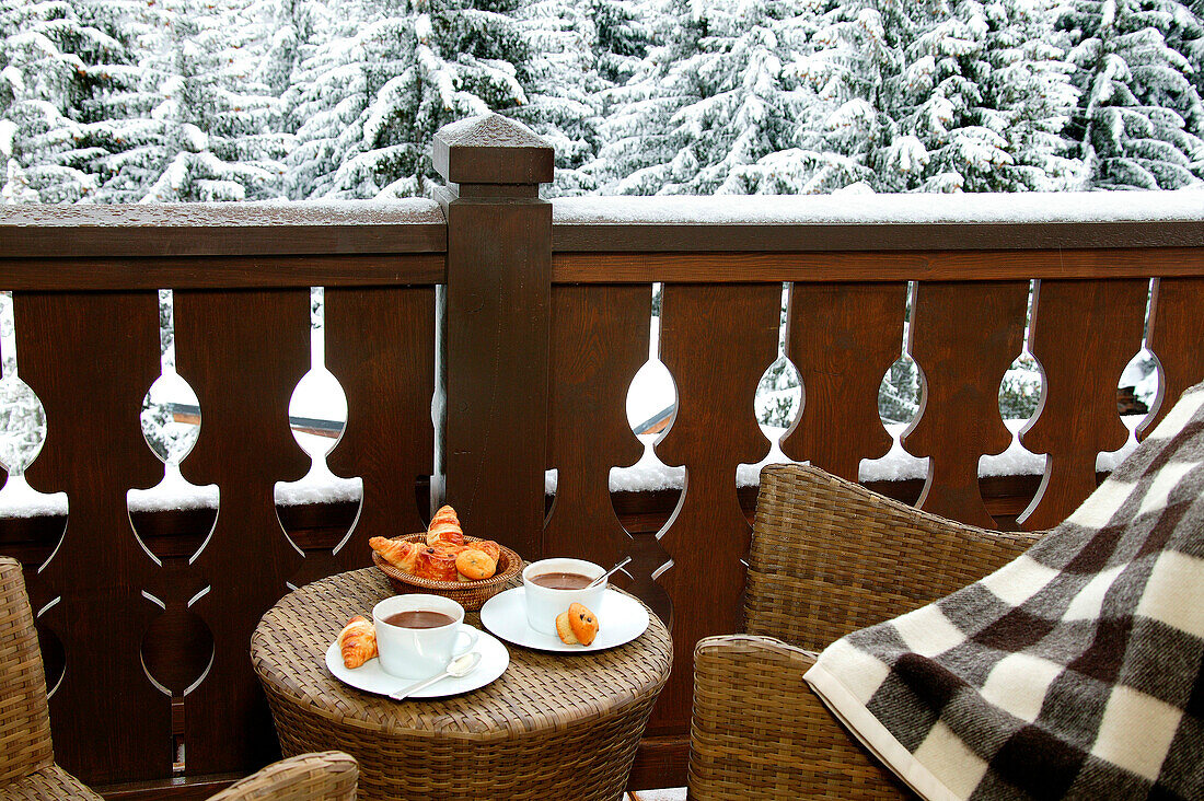 Breakfast on a terrace in winter, chalet