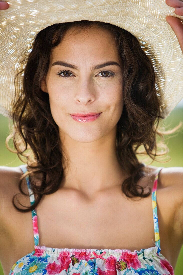Portrait of a young woman wearing a hat