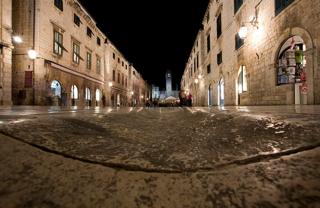 Croatia, Dubrovnik, Placa street by night, clock tower in the back