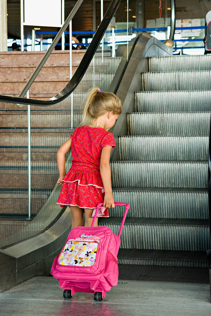 Little girl on escalator