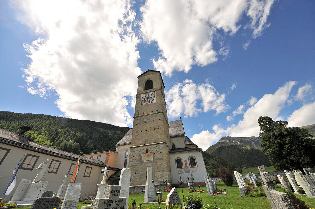 Abbey of Muestair under clouded sky, valley Muenstertal, Grisons, Switzerland, Europe
