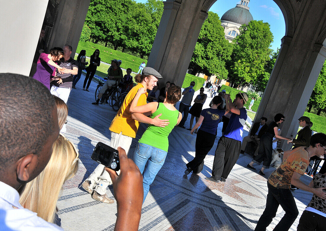 People dancing at the Diana temple at the Hofgarten, Munich, Bavaria, Germany, Europe