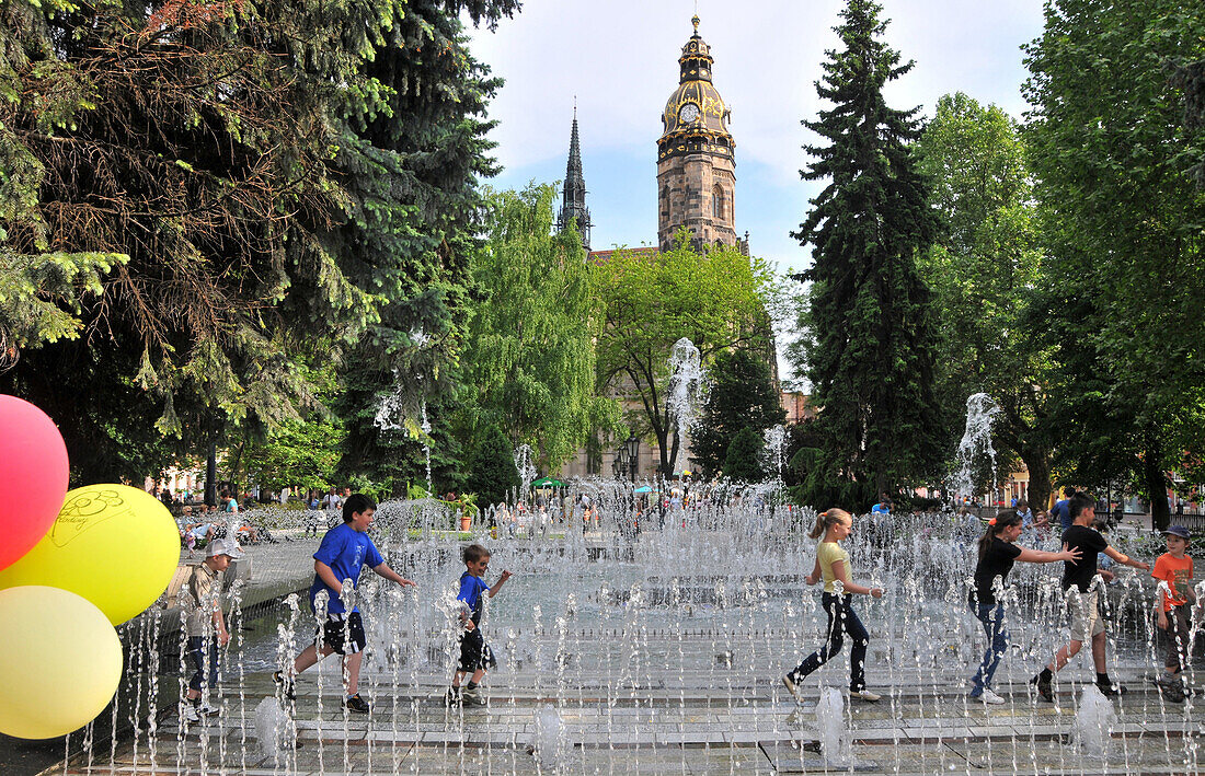 Children at singing fountain at the theatre, Kosice, eastern Slovakia, Europe