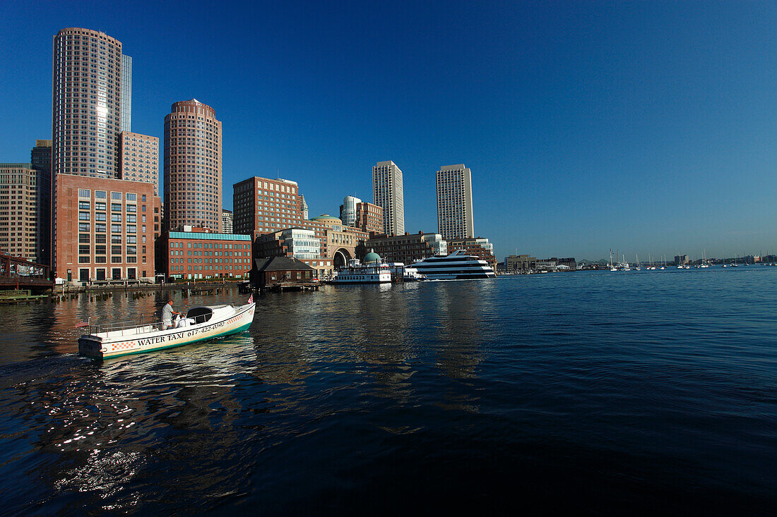 Watertaxi and view on the city of Boston, Massachussets, USA