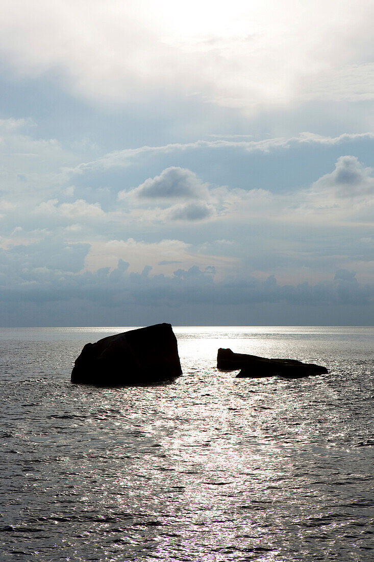 Sunrise between two rocks in the sea, Similan Islands, Andaman Sea, Thailand