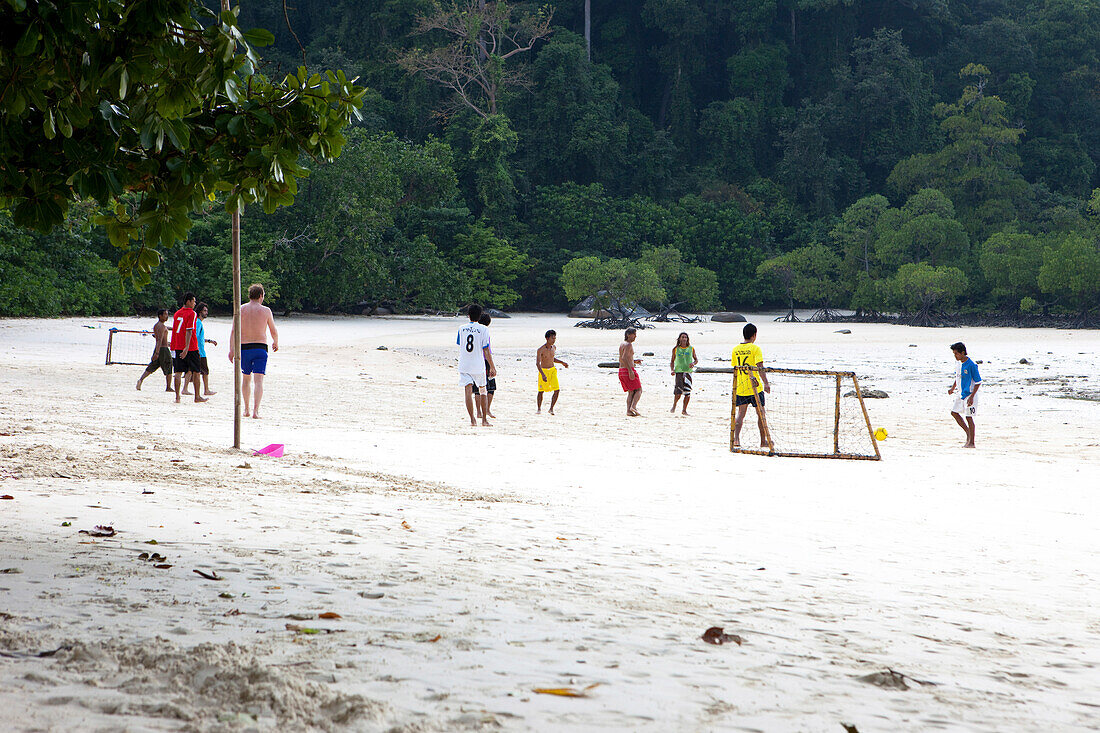 People playing soccer at Hat Mai Ngam Beach, Surin Island Maritim National Park, Andaman Sea, Thailand