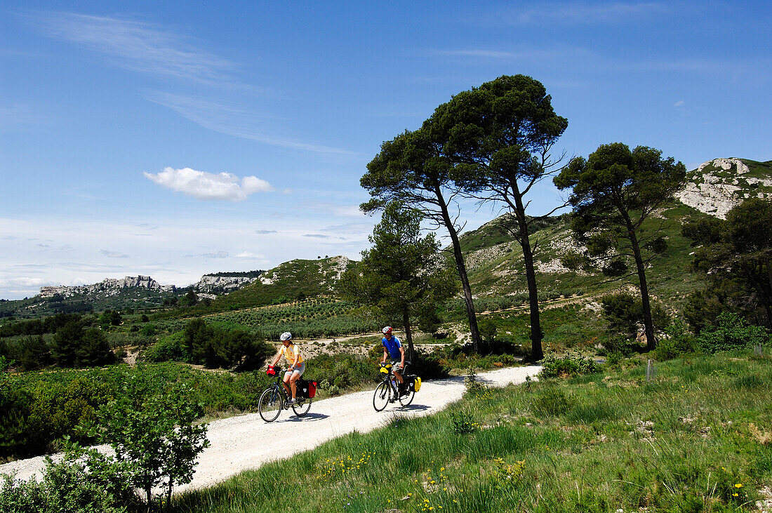 Cyclists in the mountains near Les Baux de Provence, Provence, France