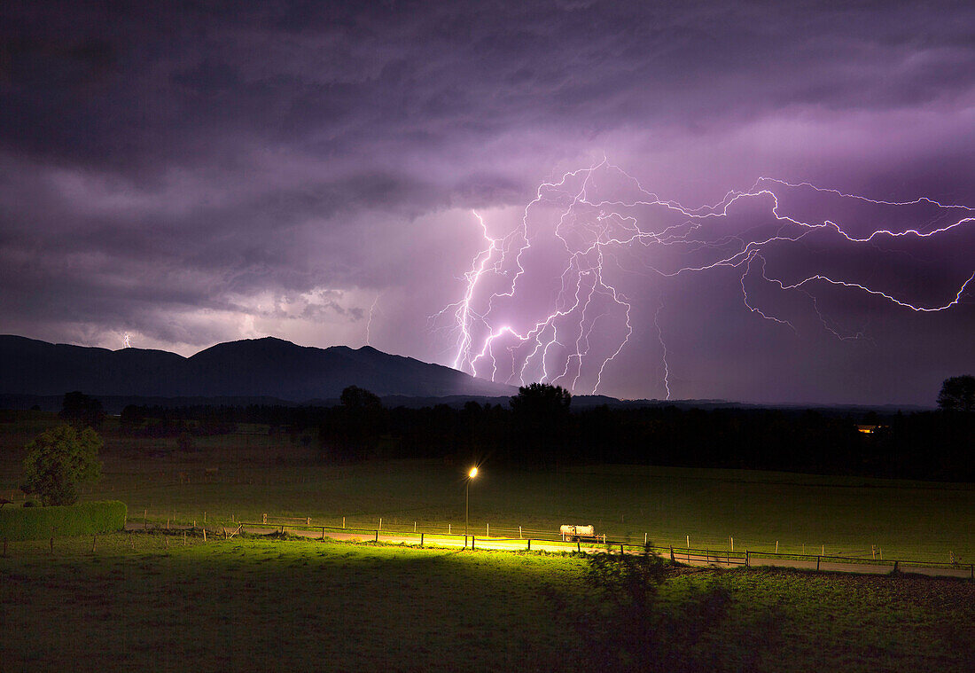 Landscape with lightning bolts from storm, Uffing am Staffelsee, Upper Bavaria, Germany