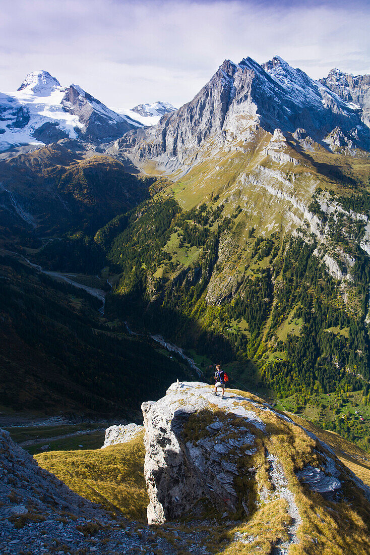 Hiker on the way to Silberhorn mountain lodge, Lauterbrunnen Valley, Canton of Bern, Switzerland