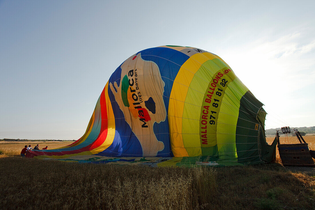 Hot air balloon lying on a field, Mallorca Ballons, plain Es Pla, Mallorca, Balearic Islands, Spain, Europe