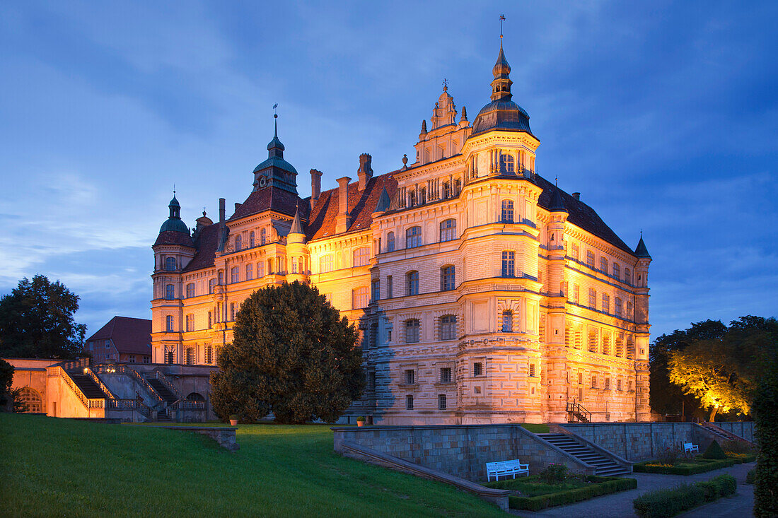 Illuminated Renaissance castle in the evening, Guestrow, Mecklenburg switzerland, Mecklenburg Western-Pomerania, Germany, Europe