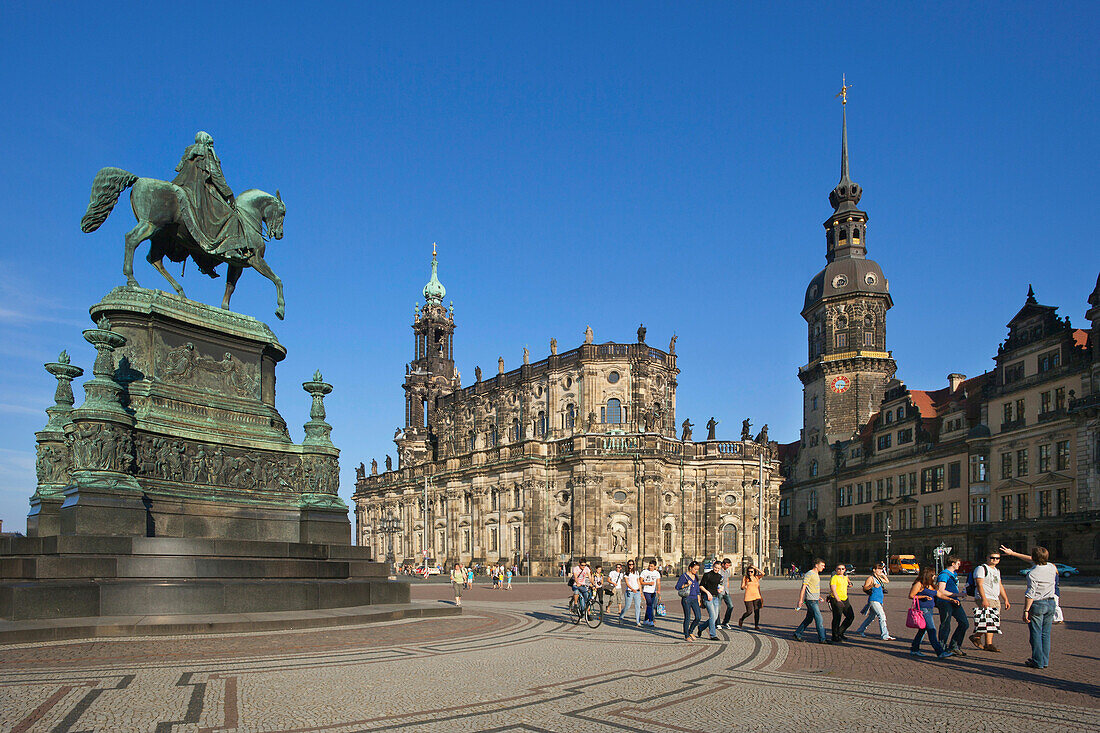 People at the Theaterplatz, equestrian sculpture of King Johann, Hofkirche and Dresden castle, Dresden, Saxonia, Germany, Europe