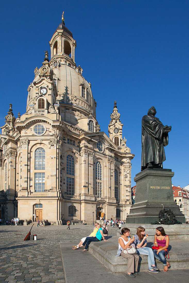 People resting at the staue of Martin Luther in front of the Frauenkirche, Dresden, Saxonia, Germany, Europe