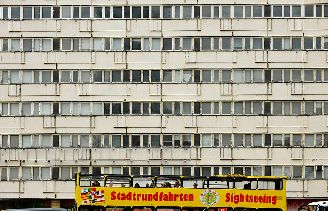 Bus with tourists in front of a Plattenbau, Alexanderplatz, Mitte, Berlin, Germany, Europe