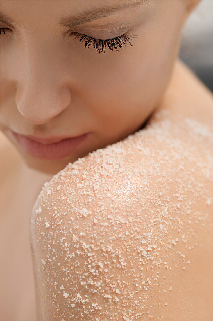 Portrait of a young woman, salt on her shoulder