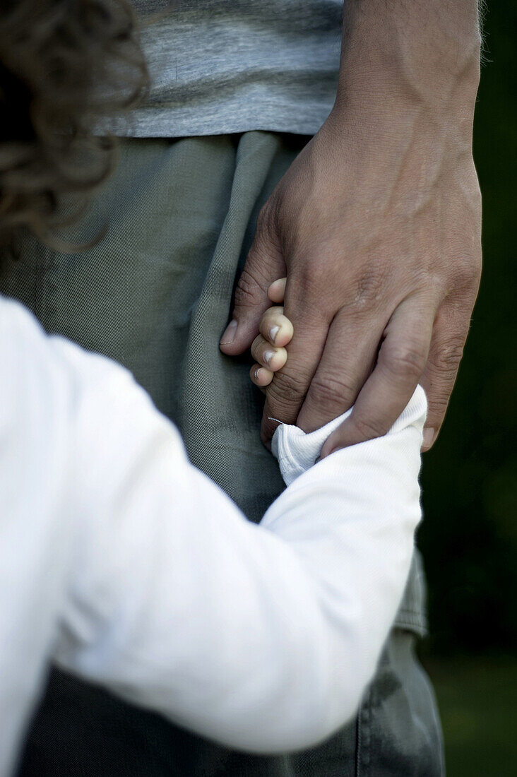 Parent and Child Holding Hands