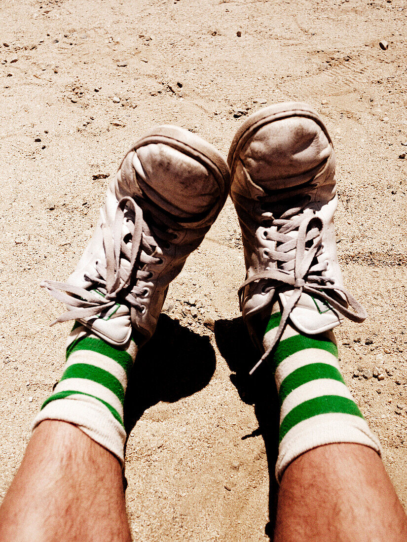 Sneakers and Socks With Green Stripes