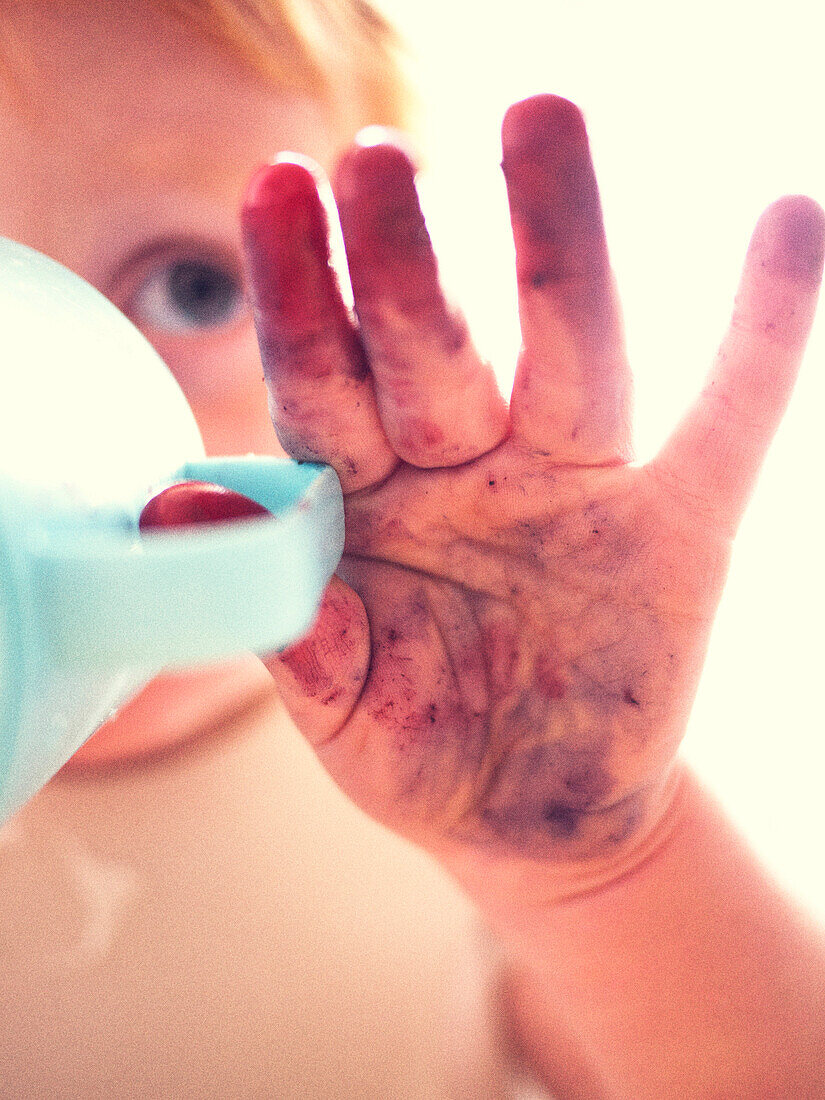 Child's Hand Stained With Blueberries