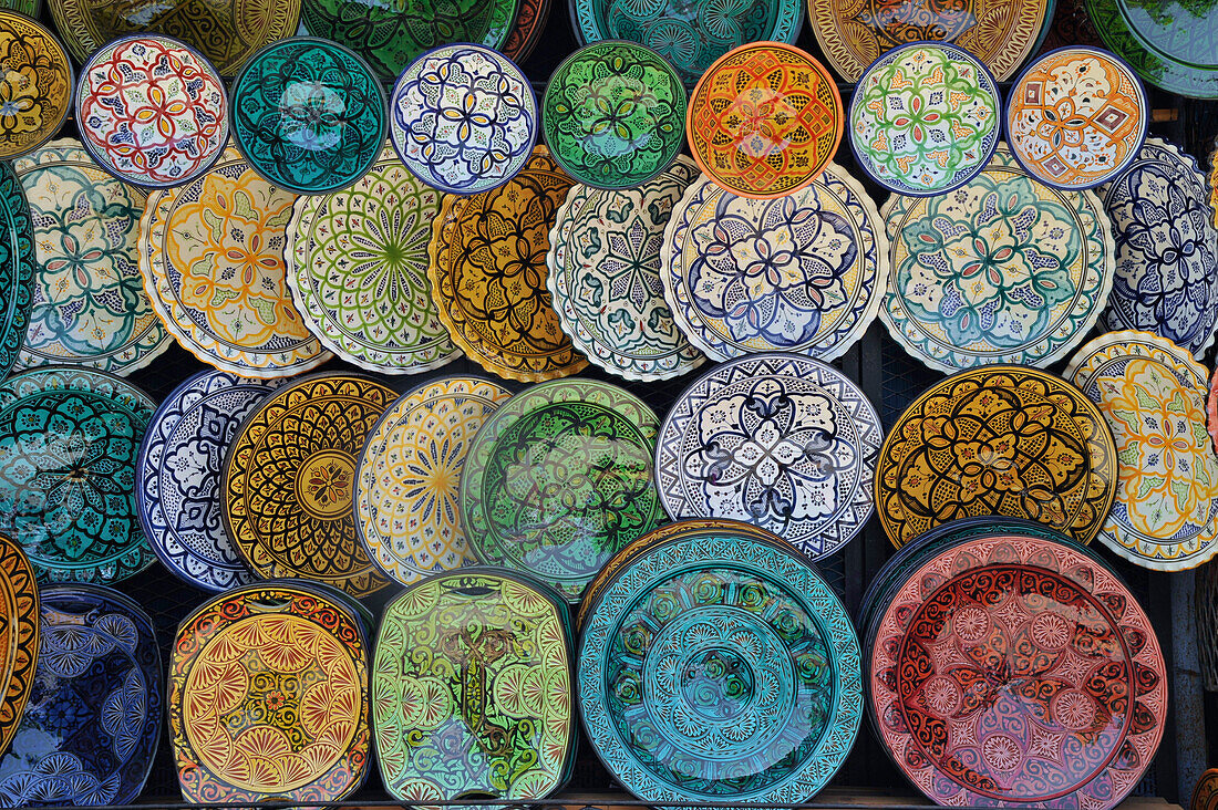 Traditional painted ceramic plates at a stall in Chefchaouen, Morocco, Africa