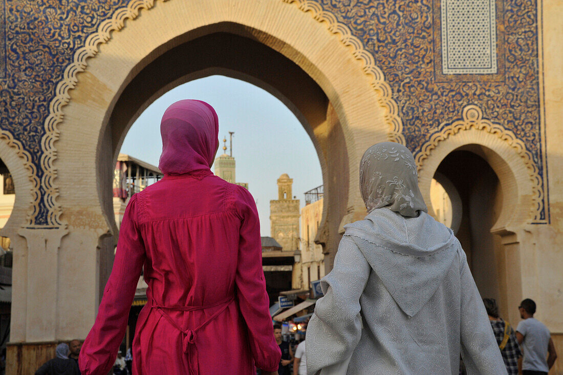 Bab Boujeloud, City gate and view into the medina, two Moroccan women walking into the medina, Fes, Morocco, Africa