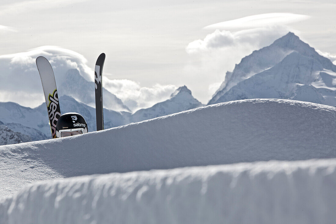 Skier ascending through deep snow, Chandolin, Anniviers, Valais, Switzerland