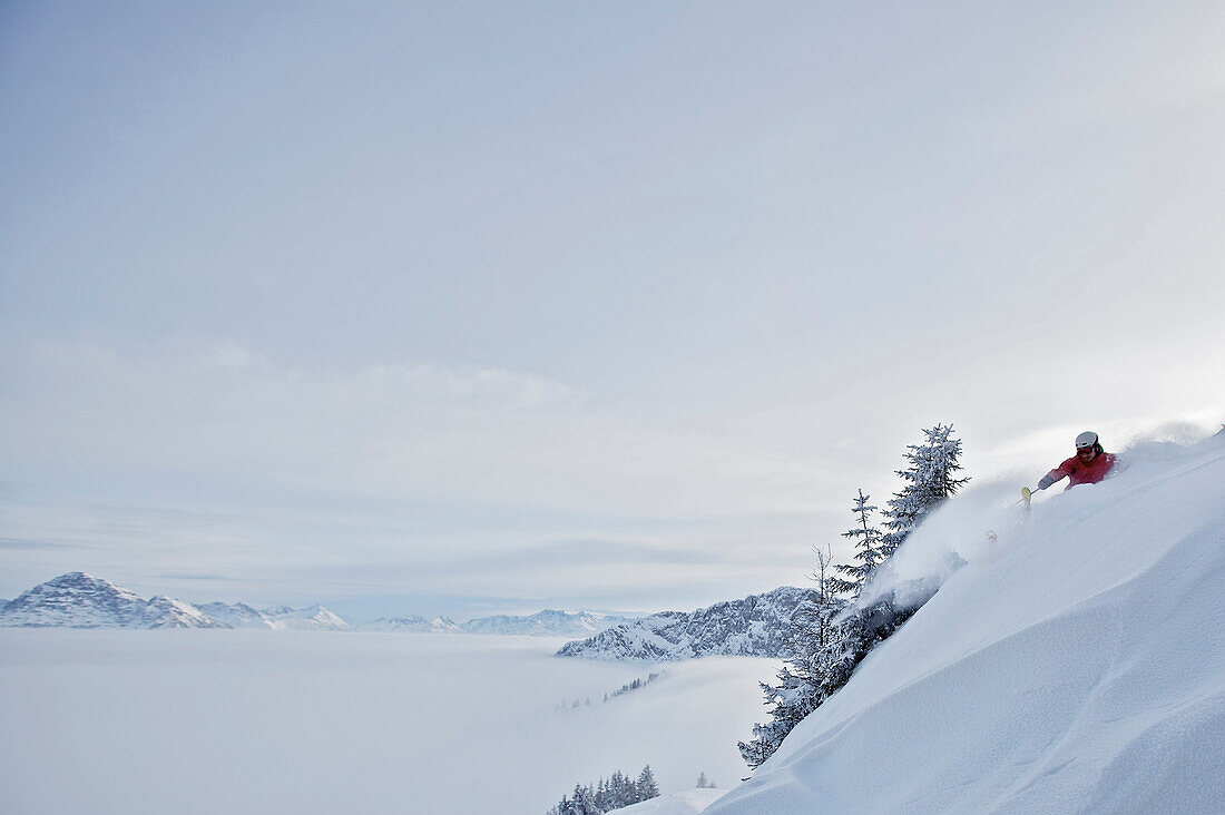 Downhill skiing in deep snow, Hahnenkamm, Kitzbuehel, Tyrol, Austria
