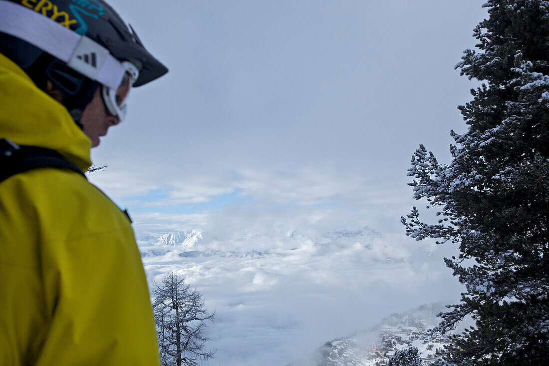 Snowboarder enjoying panoramic view, Chandolin, Anniviers, Valais, Switzerland