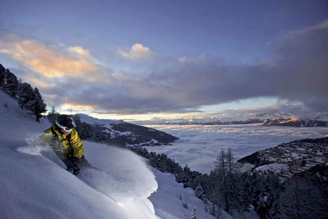 Snowboarder in deep snow, Chandolin, Anniviers, Valais, Switzerland