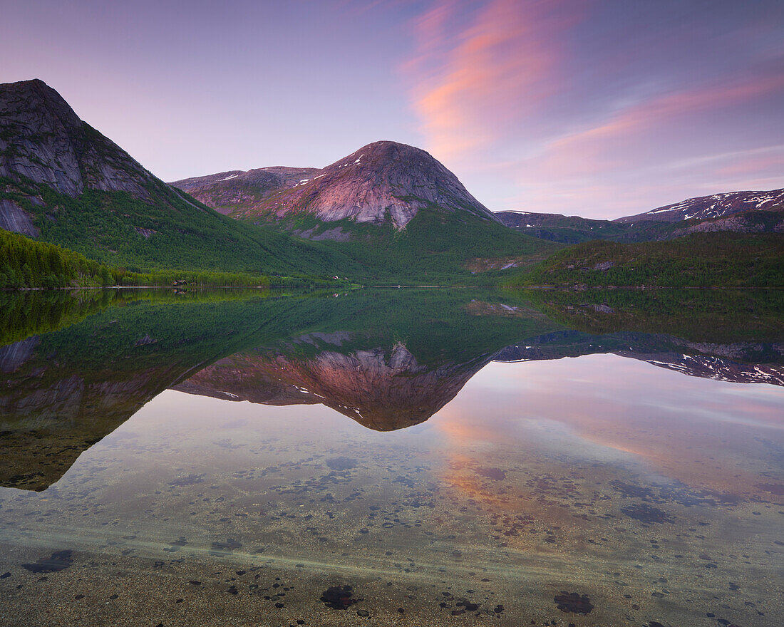 Reflection of mountains in lake Morsvikvatnet at sunset, Durmaltinden peak, Sorfold, Nordland, Norway