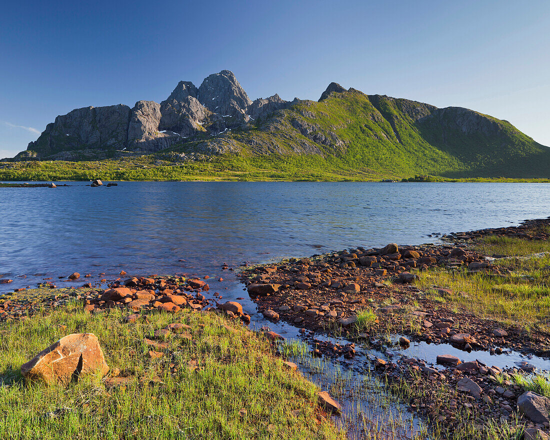 Coastal landscape near Vagan, Vagakallen  mountain in the background, Austvagoya, Lofoten, Nordland, Norway